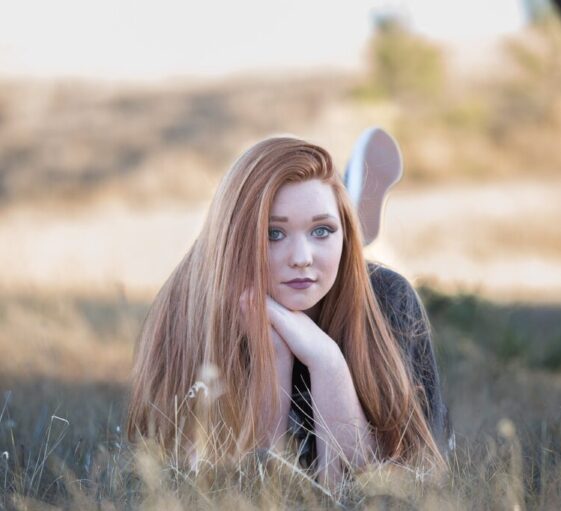 redhead girl lying down grass 1996288